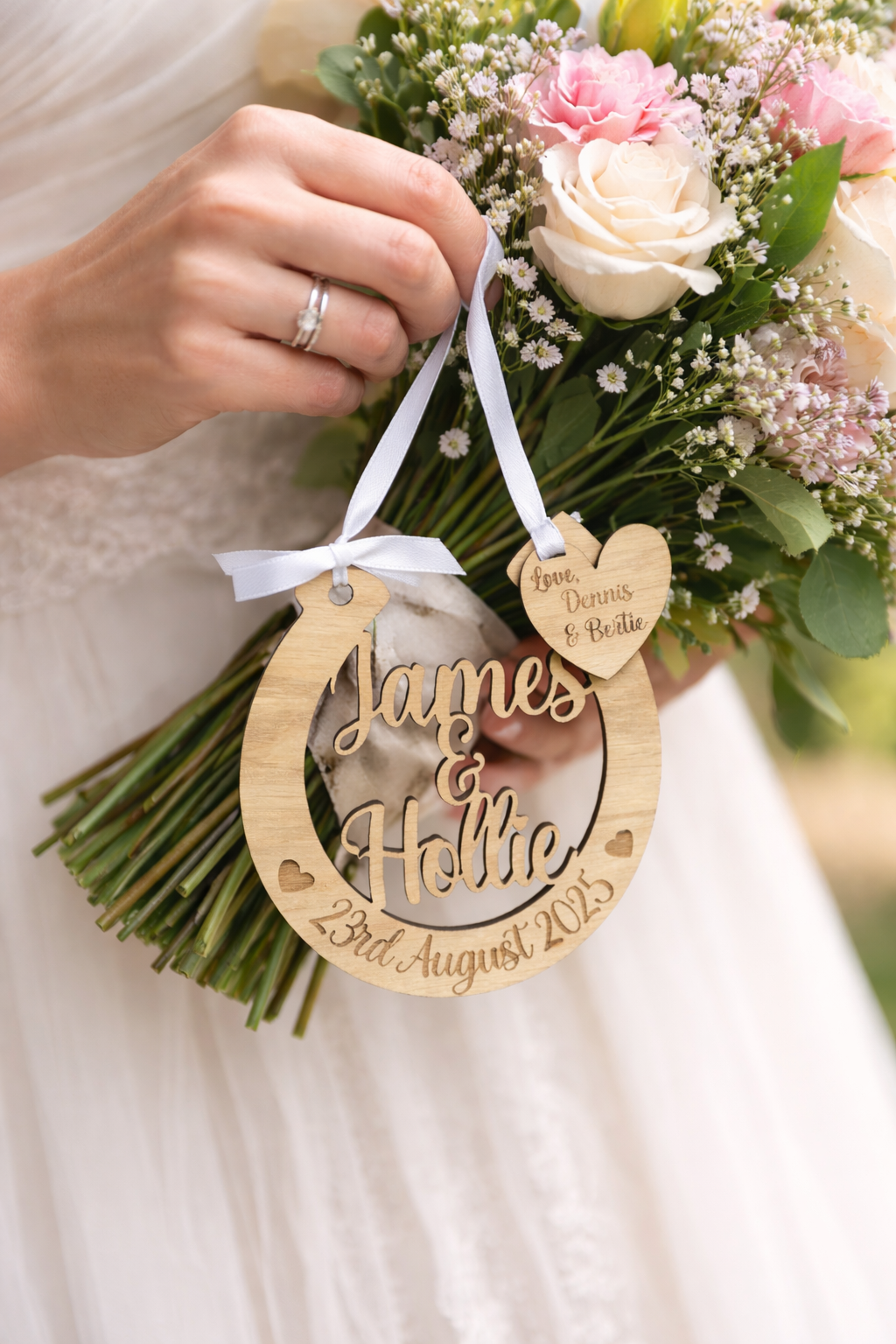 Handmade oak personalised wooden horseshoe engraved with names and date. Perfect rustic wedding décor, bridal bouquet charm, and meaningful wedding keepsake gift.